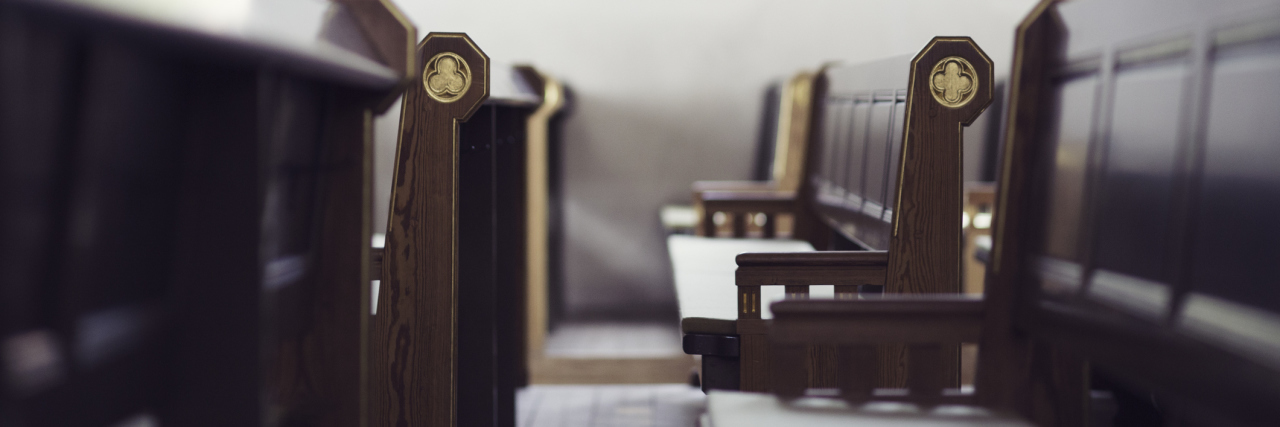 How the Church Can Respond to Those With Chronic Illness A picture of wooden pews in a church.