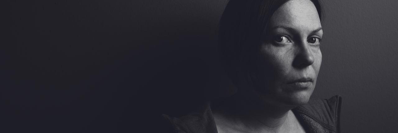 How Being Unemployed Effects Your Health A black and white portrait of a woman with a serious expression on her face