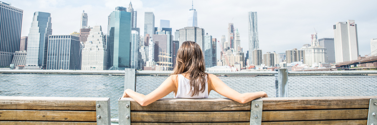 How I Opened Up About My Schizophrenia Diagnosis – and Started Helping Woman watching New York skyline
