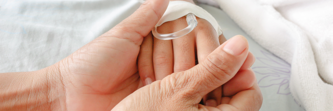 Why Natalie Merchant's Lyrics Remind Me of My Journey With Illness mother holding child's hand who has an iv