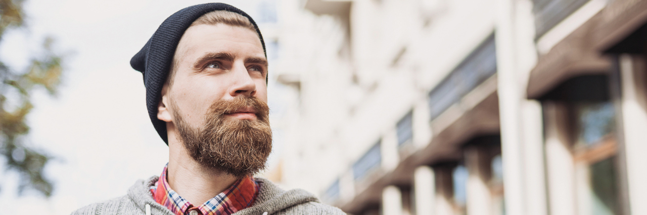 I Am Not 'a Person With Epilepsy.' I Am an Epileptic. A man outside, looking up to the sky.