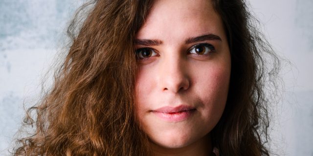 How Neurofeedback Can Help With Depression A portrait of a woman with a serious expression.