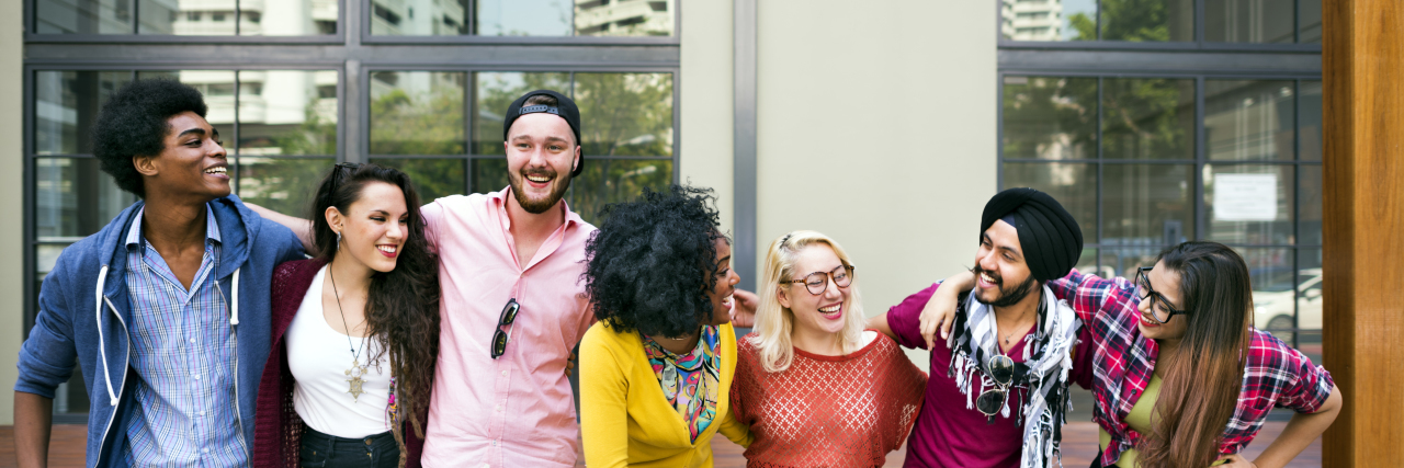Advice for College Students on the Autism Spectrum College students of varied ethic backgrounds linking arms, smiling and laughing.