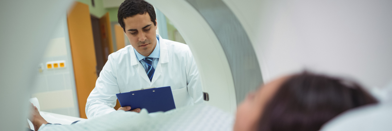 When a Radiology Technician Told Me 'It Must Be Nice' to Miss Work A patient having a CT scan don with a technician setting things up.