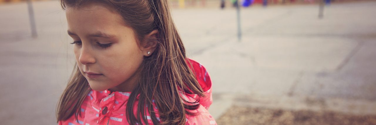 Advice for Working With Students After a School Shooting Sad girl in the school playground