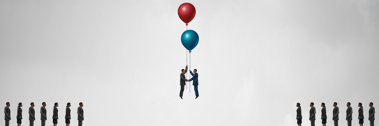 An image of a gap, but two people holding onto balloons and floating together in the middle of the gap.