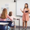 A high schooler giving a presentation to her class.