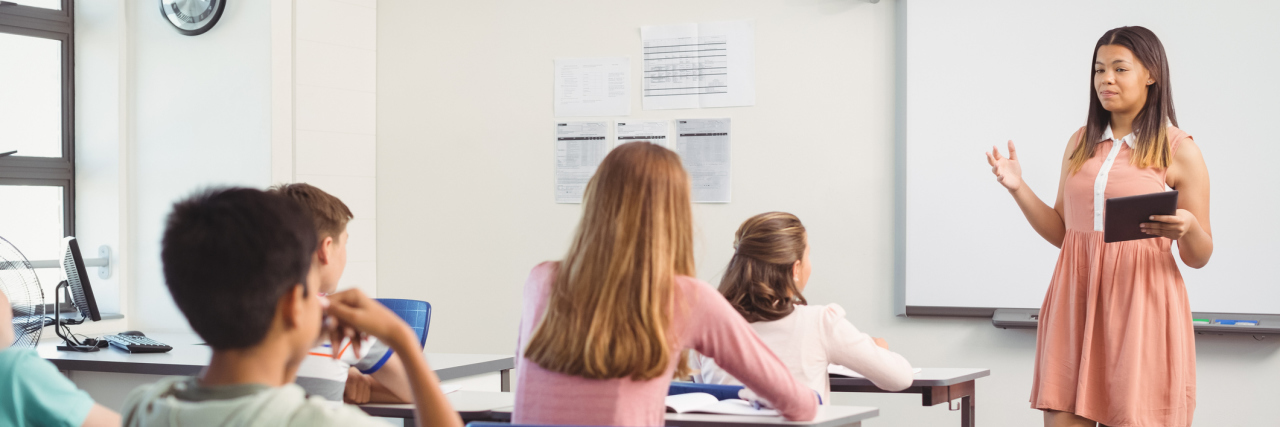 A high schooler giving a presentation to her class.