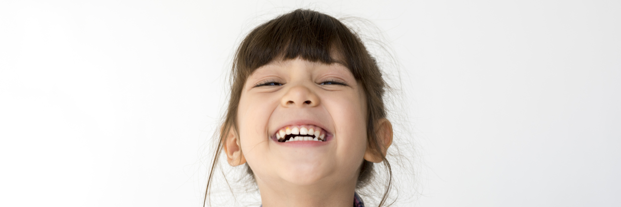 Bullying Kids With Celiac for Laughs: Blame a Lack of Creativity Mixed race girl big smile head shot portrait