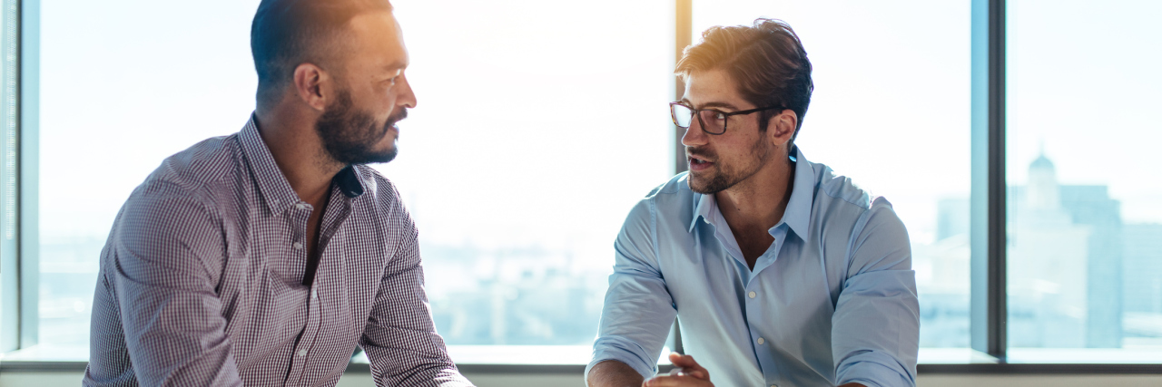 Being Asked 'How Are You?' When You Have Chronic Pain two men sitting at a table talking