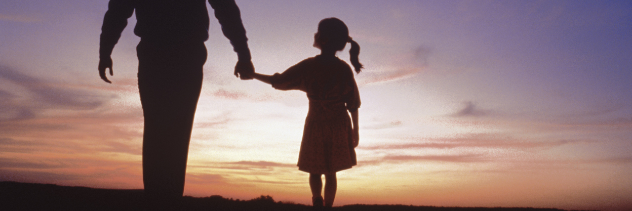 Treasured Life Lessons From My Father, Who Died When I Was 5 A father and daughter walking and holding hands.