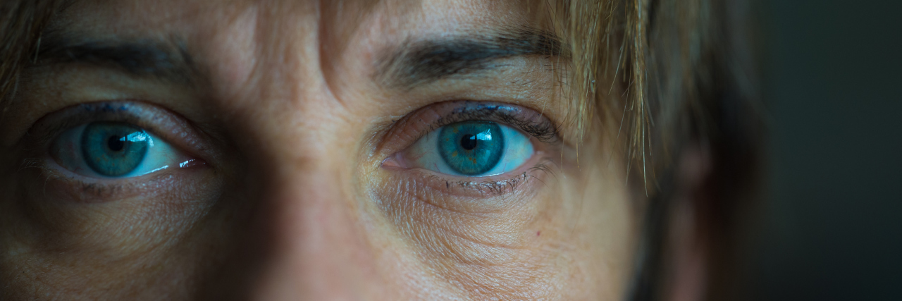 12 Signs I'm Having a 'Nothing Day' Because of My Asthma A middle-aged woman looking at the camera, with the photo being a close-up of her eyes.