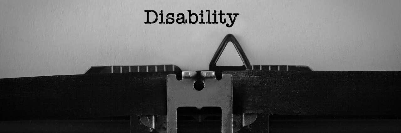 Redefining the Word 'Disability' Text DISABILITY typed on retro typewriter.
