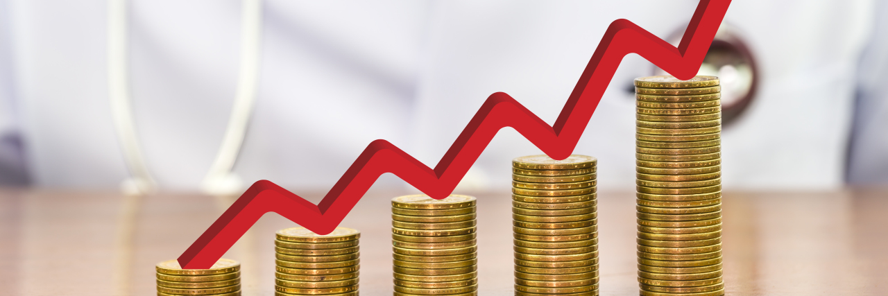 Opportunity Costs of Healthcare in the United States Red arrow over stack of money coins arranged as a graph with doctor in the background.