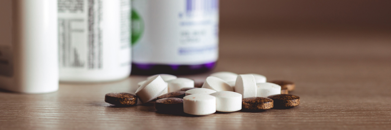 Study Shows More Doctors Reducing Opioid Prescriptions Variety of prescription medicines and painkillers with pill bottles in the background.