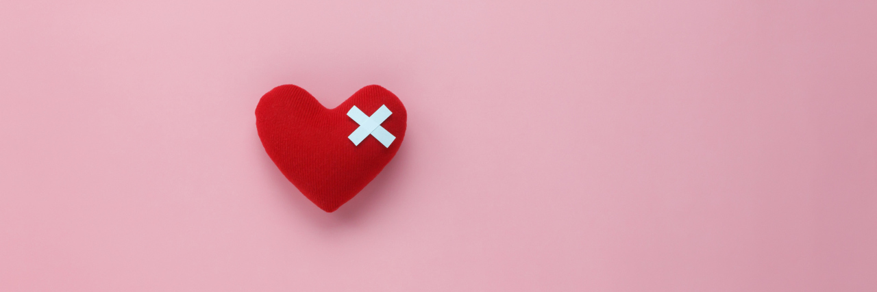 Why It's Hard to 'Brush Off' Comments Made About My Illness A picture of a heart with a bandage on top.