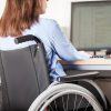 Disabled woman working on computer.