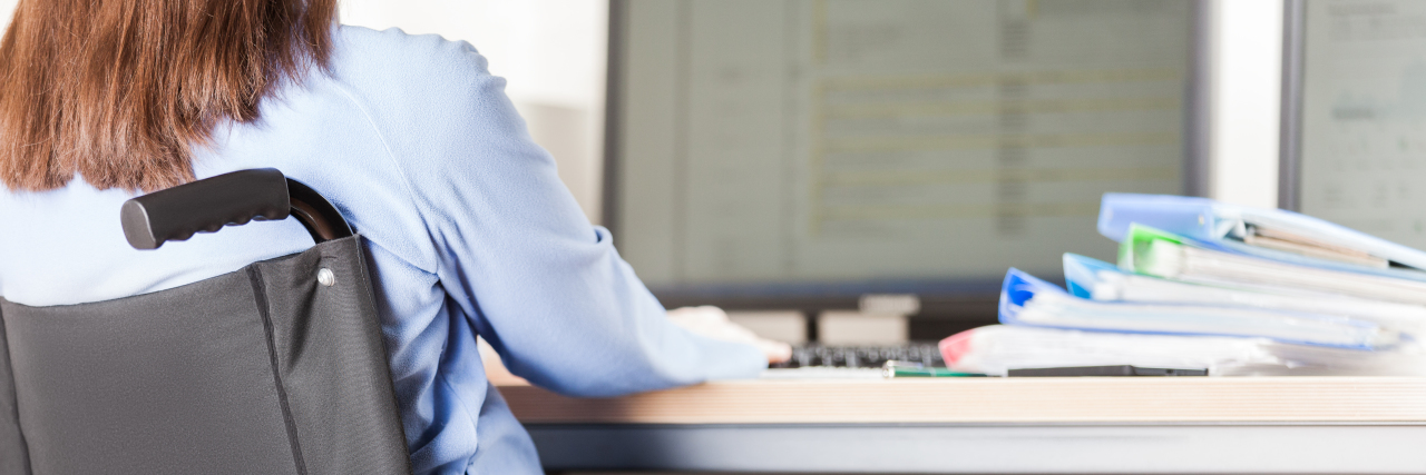 Choosing Self-Employment as a Person With a Disability Disabled woman working on computer.