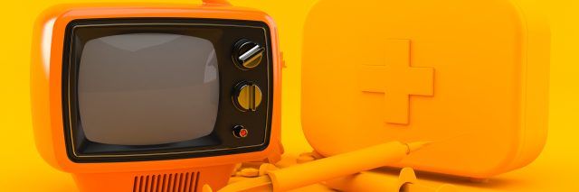 A picture of an orange TV with orange medical supplies, in front of an orange background.