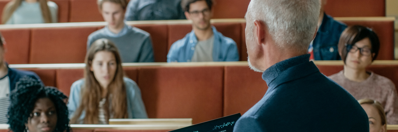 Dealing With Tough Professors as a College Student With Autism Professor with students at lecture hall.