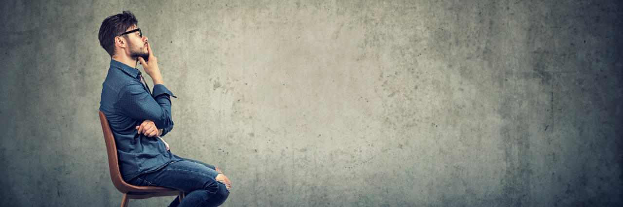 Facing Testicular Cancer? Try Practicing Mindfulness. Pensive man sitting against gray
