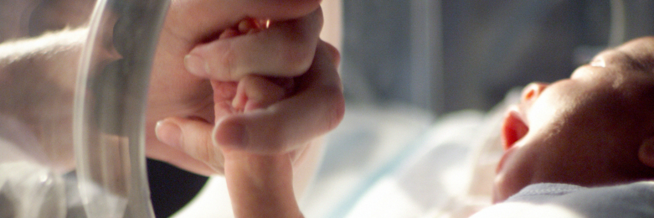 Letter to the Doctors and Nurses Who Saved My Son’s Life in the NICU Close up of baby in NICU black and white image