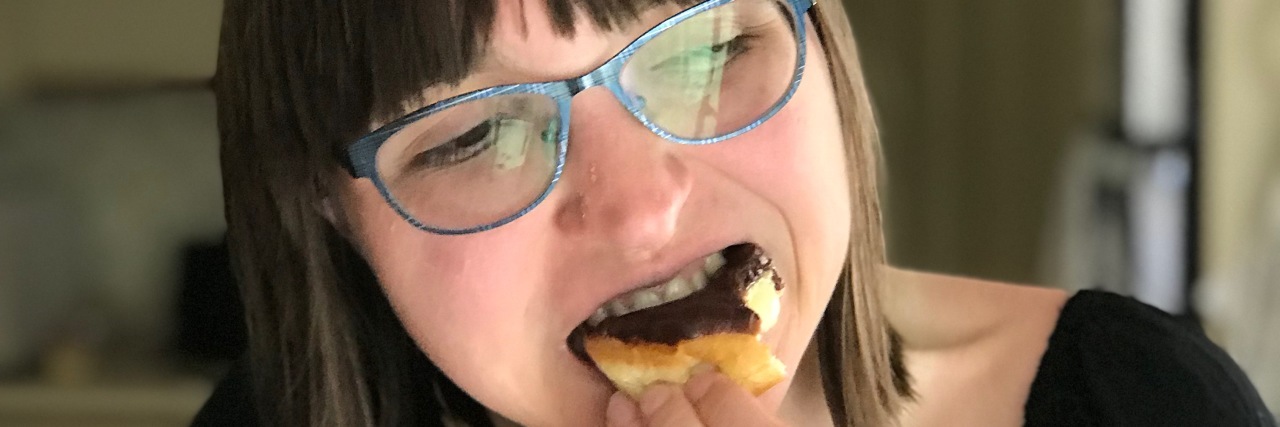 The Problem With Asking People, 'Should You Be Eating That?' A picture of the writer eating a donut for the first time in three years.
