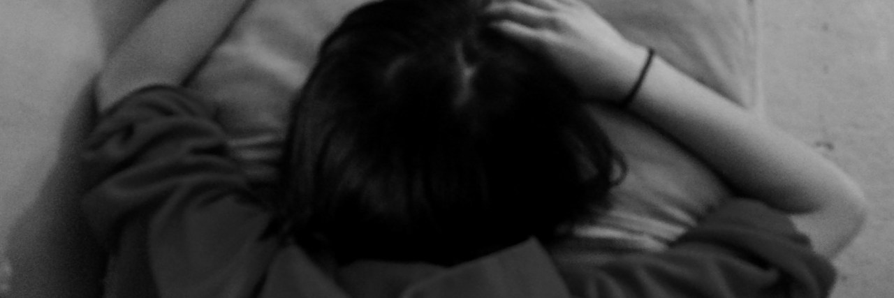 What Tiredness Is Like With Lyme Disease black and white photo of woman sleeping