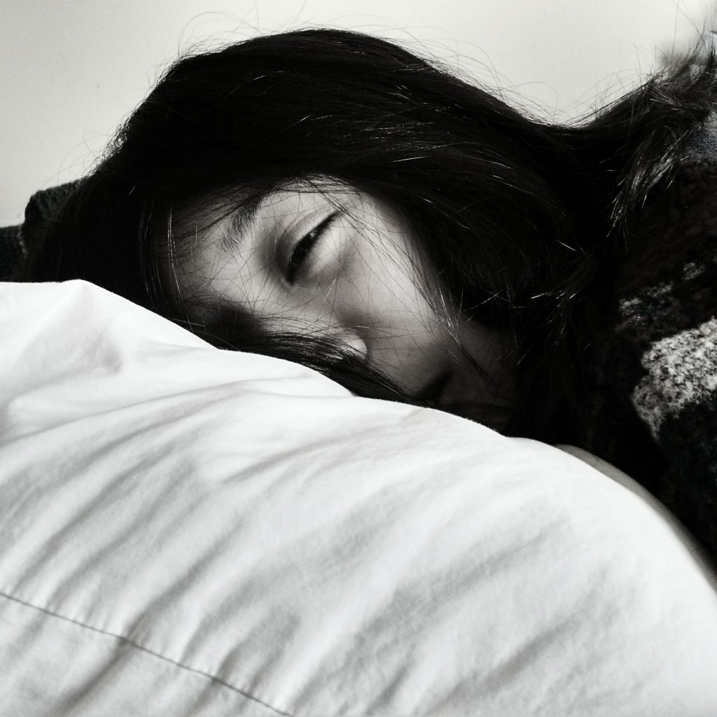 black and white photo of woman sleeping