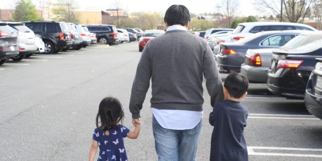 Why You Shouldn't Say, 'Let Me Know If You Need Help' to a Person Battling Cancer dad with his two kids in a parking lot