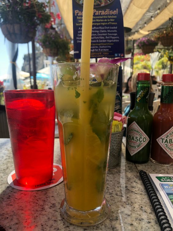 Image of a long piece of pasta in a mojito at a restaurant.