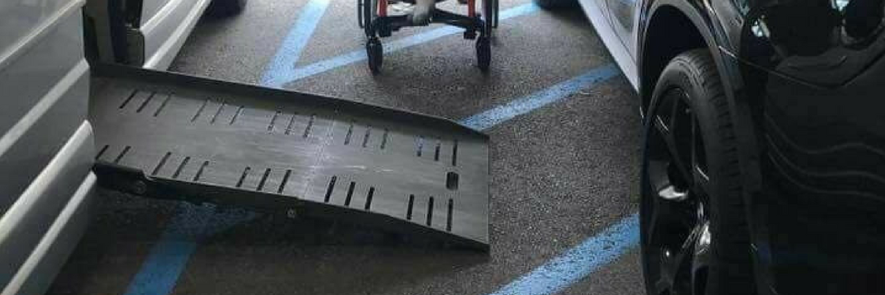 Officer Shares Photo to Show Why You Can't Park Near Handicap Spots Image of a handicap accessible van with the ramp out with a car parked on the stripped loading area. A oung child sits between the cars showing it is impossible for him to access the ramp into his vehicle because of the car blocking access to the ramp