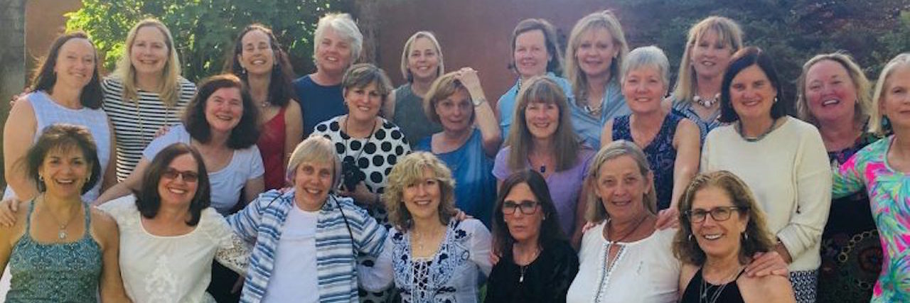 How I Pushed Through Trigeminal Neuralgia for a High School Reunion group of women outdoors surrounded by trees