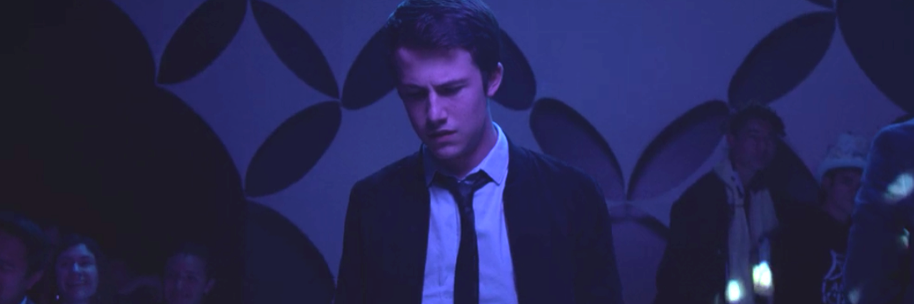 Photo of Clay looking sad at the school dance.