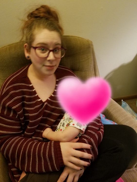 mom holding her child