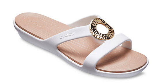 white sandal with gold ring on top