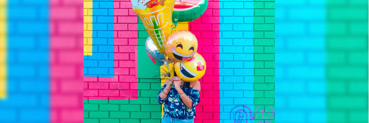 My Trick for Getting Through Parties as Someone With Social Anxiety woman with balloons