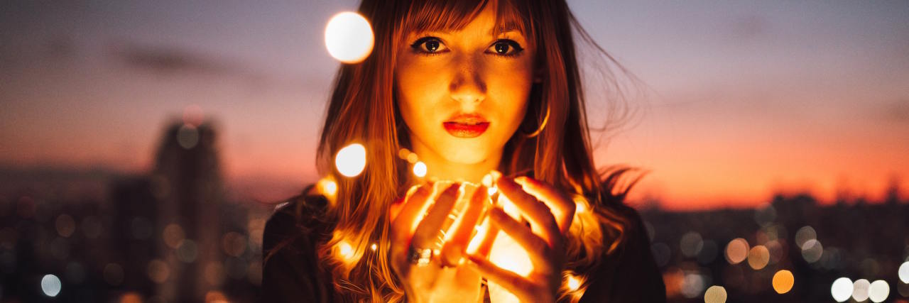 What It's Like to Experience Depersonalization woman with lights