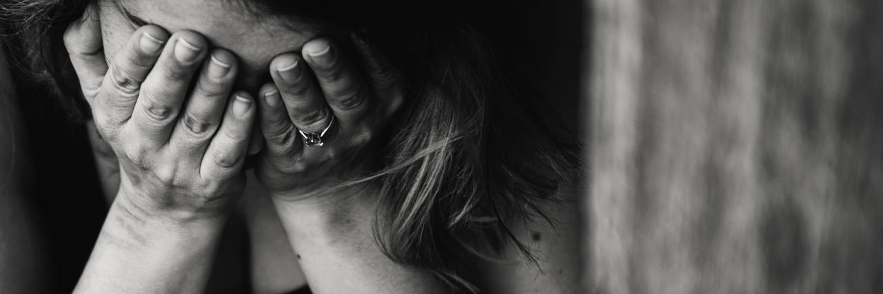 When Being Sick Makes You Feel Selfish black and white photo of a woman with her head in her hands