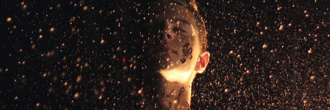 Finding Happiness in What You Have With Lupus woman surrounded by raining golden glitter