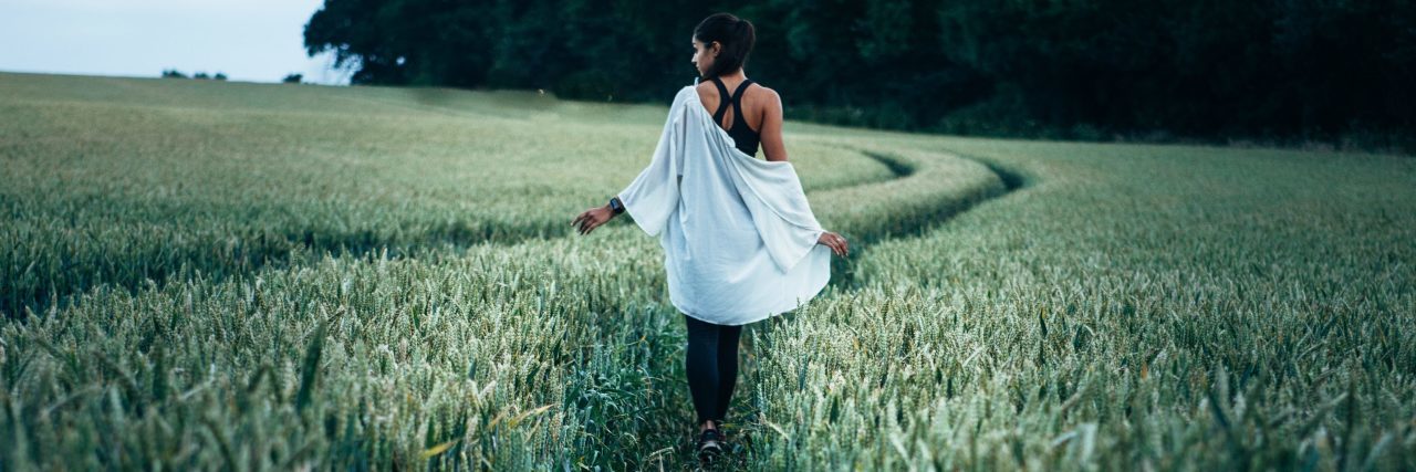 What I Want You to Know About Therapy Before You Start woman walking in field along lines made by tractor