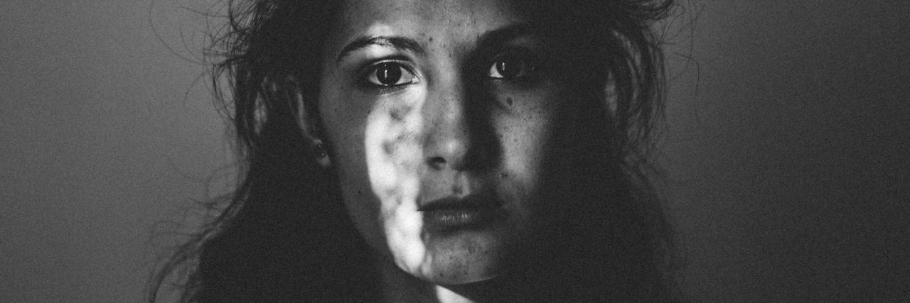 Why 'Letting Go' of My Childhood Trauma Won't Cure My Mental Illness woman sad