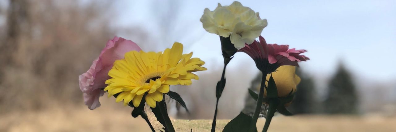 My Feelings After Ending Therapy for Depression flowers in small vase resting on path