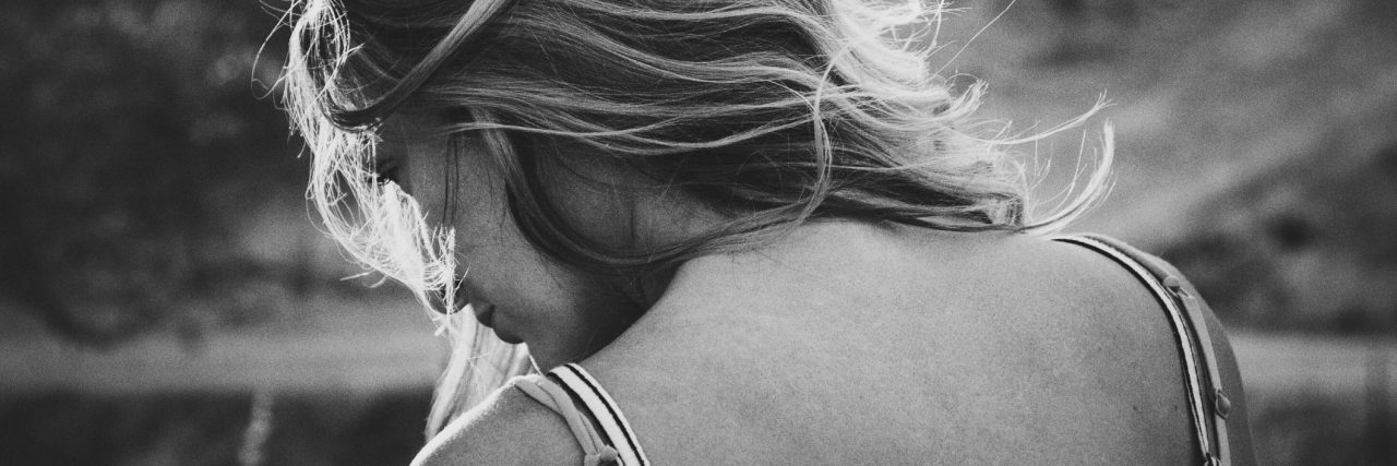 How I Realized I Had Sensory Processing Disorder black and white photo of young woman over shoulder