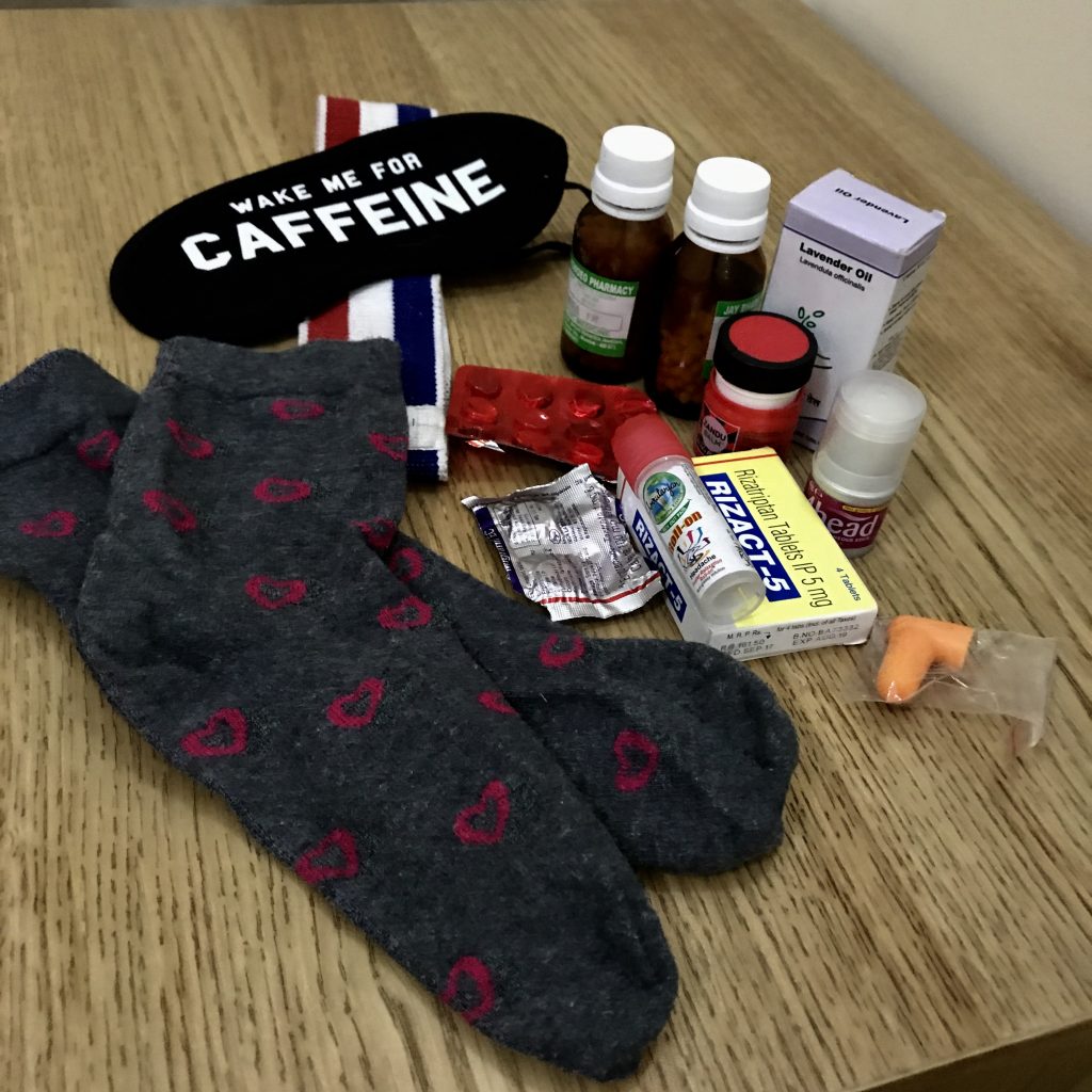 bedside table full of emergency migraine supplies