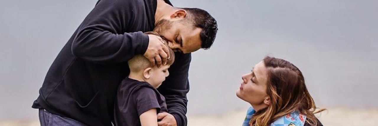 The 'Saving Carter' Campaign for Sanfilippo Syndrome Jen, looking at her son with her husband