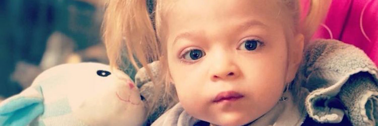 When Your Child Gets Diagnosed With Multiple Sulfatase Deficiency the author's daughter with a stuffed animal