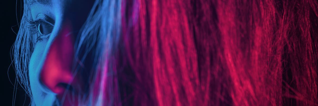 When Mental Illness Affects More Than Just Your Thoughts and Feelings woman's face in blue and pink light