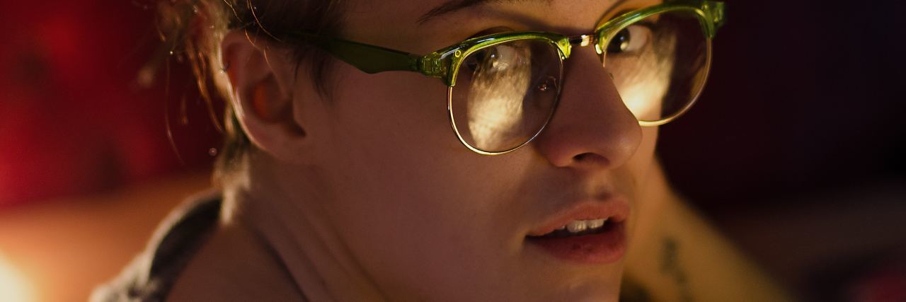 When You're Struggling to Stop Self-Harming woman with glasses looking up at the camera