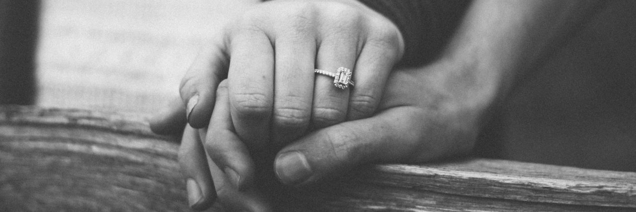 What to Know If Your Partner Has a Mental Illness black and white photo of married couple holding hands